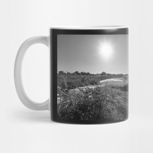 Rowing boats on the river bank in Thurne, Norfolk Mug